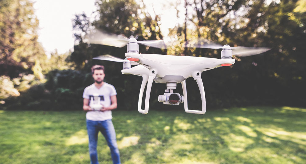 powerdms-assets-photos-031-man-flying-drone