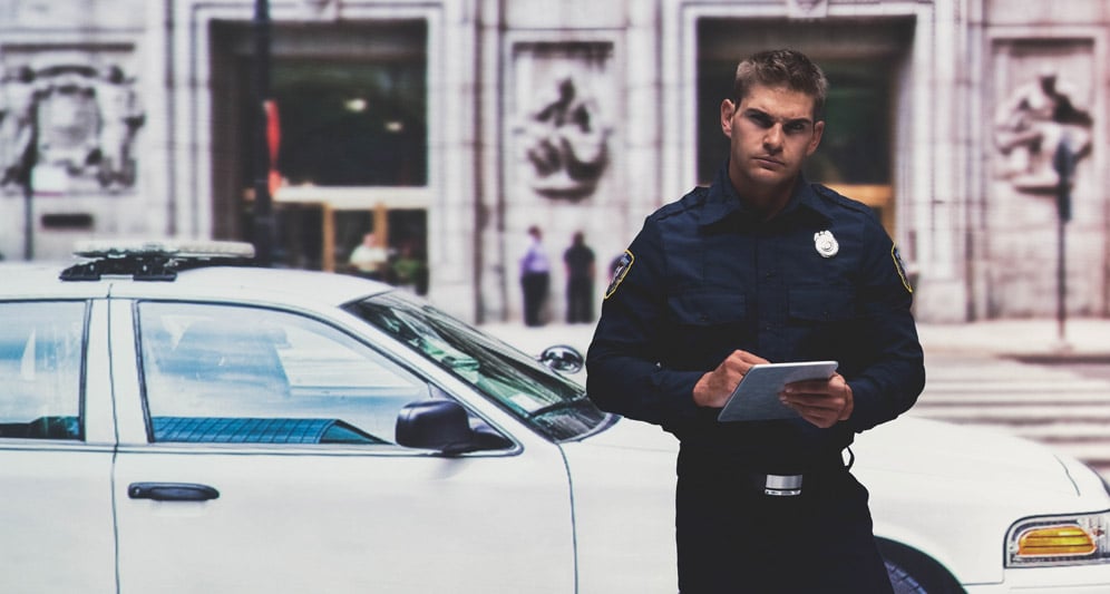 powerdms-assets-photos-013-officer-looking-tablet