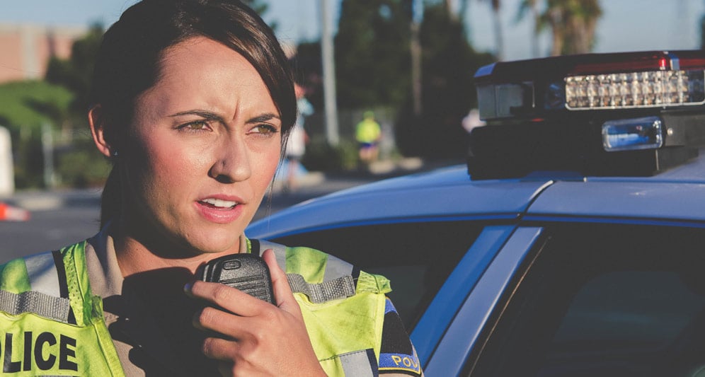 powerdms-assets-photos-082-female-officer-walkie-talkie