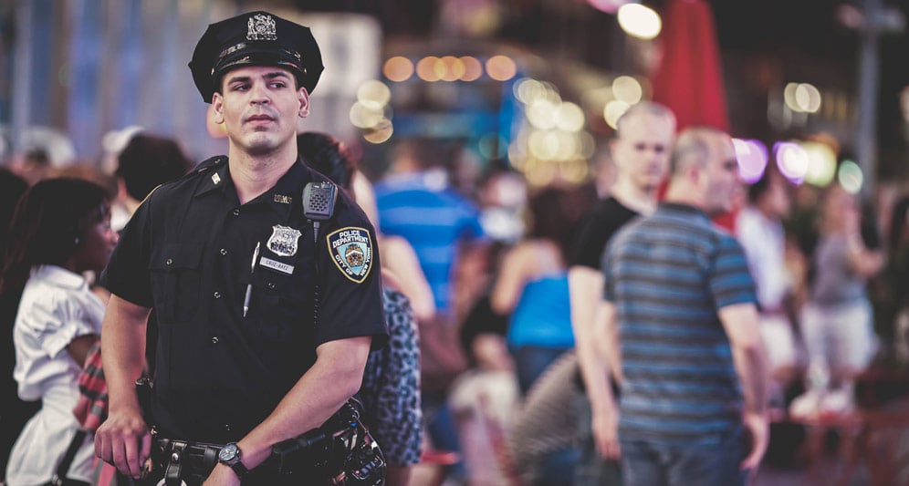 powerdms-assets-photos-015-officer-standing-city-night