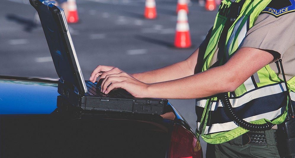 powerdms-assets-photos-025-officer-computer-car-duty