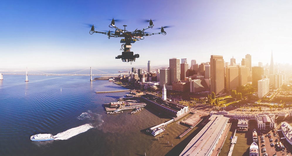 powerdms-assets-photos-027-drone-flying-city-1