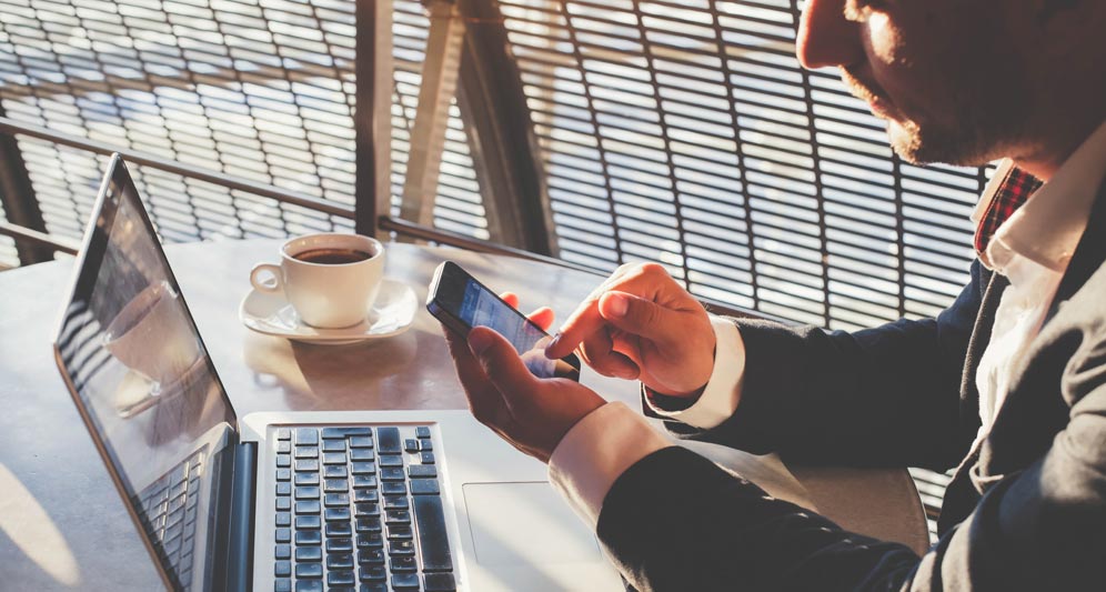 powerdms-assets-photos-041-business-man-on-phone-with-laptop