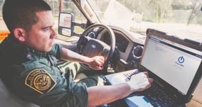 powerdms-assets-photos-045-police-officer-using-app-car-laptop