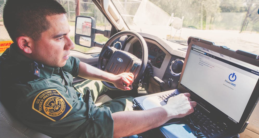 powerdms-assets-photos-045-police-officer-using-app-car-laptop