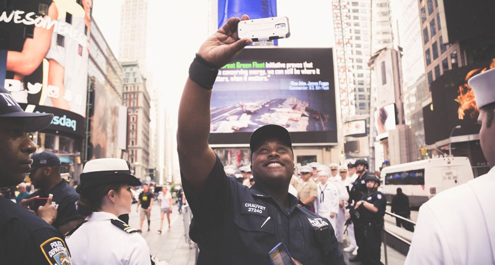 powerdms-assets-photos-054-cop-taking-selfie