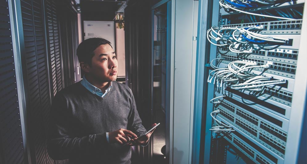 powerdms-assets-photos-080-man-working-in-server-room