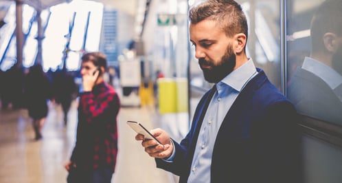 powerdms-assets-photos-090-business-man-on-iphone-1