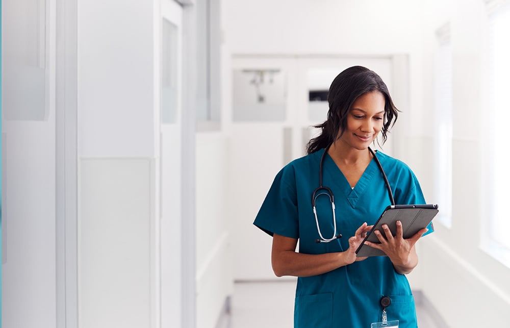 nurse on tablet device