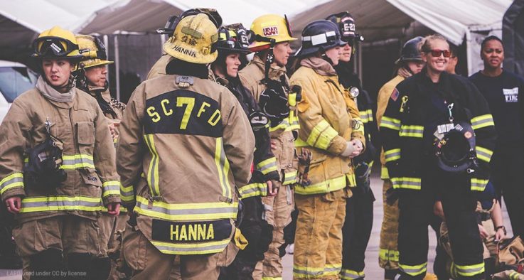 Female firefighters in full gear.