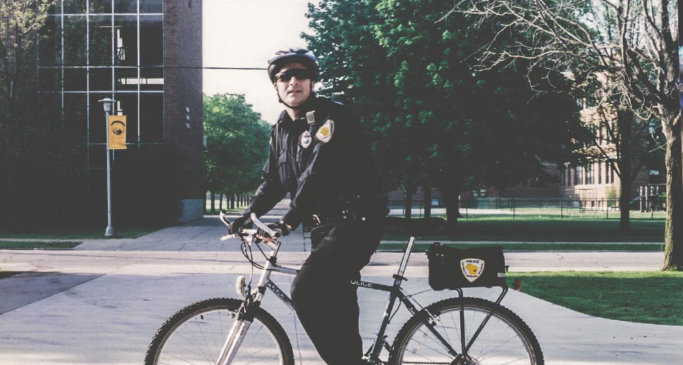 Policeman on duty riding a bike