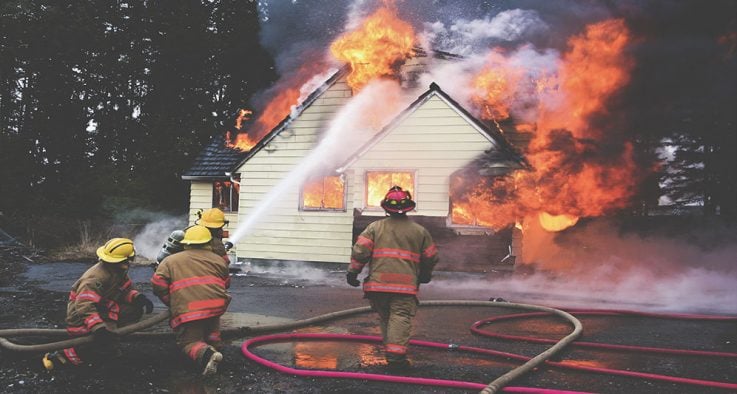 firemen putting out house fire