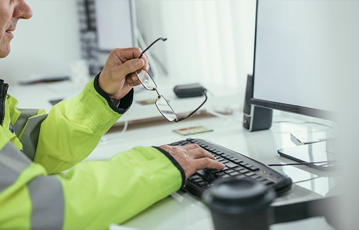 Person typing on keyboard