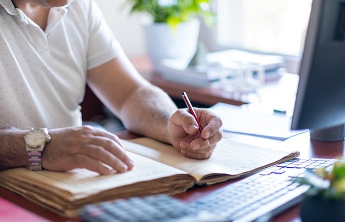 Person writing in notebook