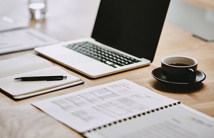 Laptop with coffee cup