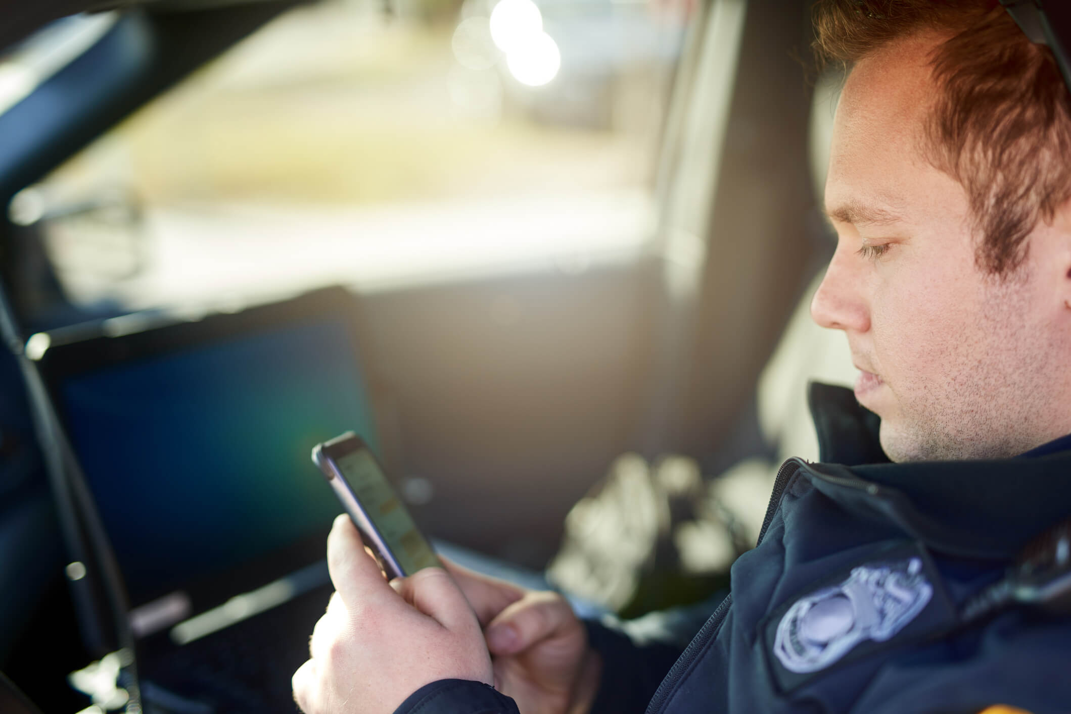 police officer using cell phone for policy training