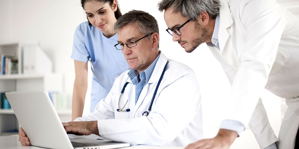healthcare-workers-review-policy-on-computer