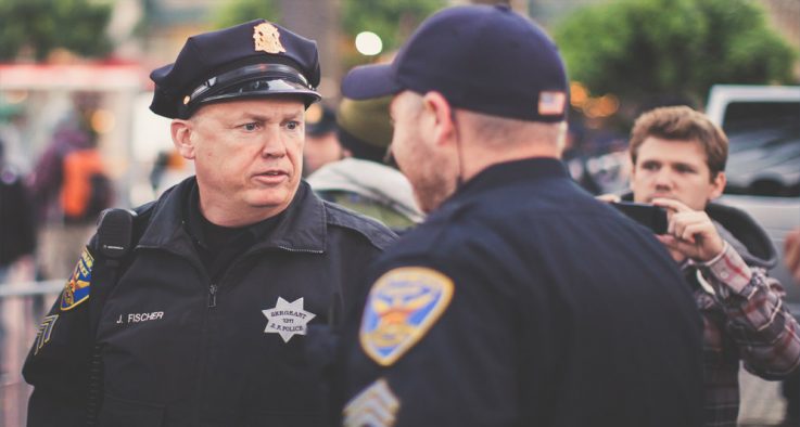 Policemen talking on duty