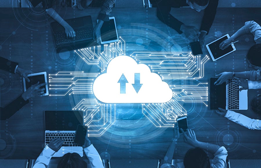 employees on laptops connecting to the cloud