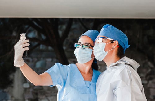 Two healthcare employees taking a selfie