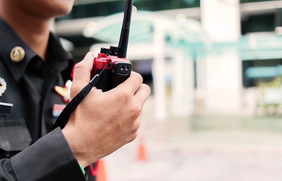 police officer holding walkie talkie