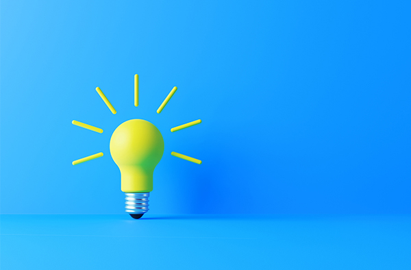 yellow lightbulb blue background