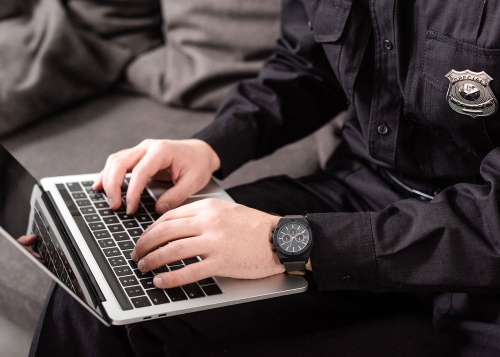 police-typing-on-computer